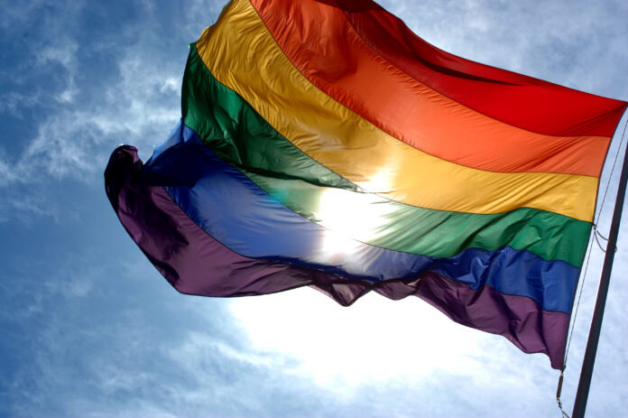 Rainbow_flag_and_blue_skies (1)